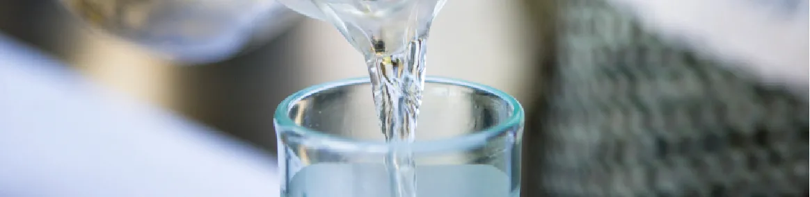 water being poured into a drinking glass
