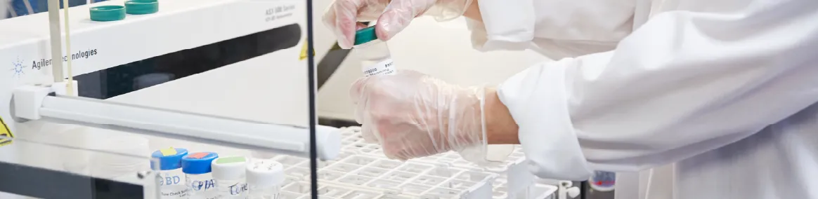 water quality lab technician working with drinking water samples